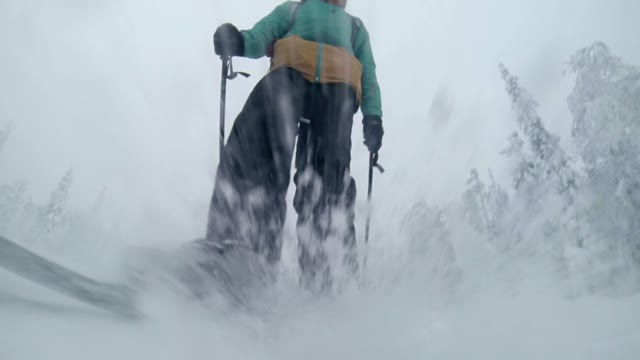 Young Skier Slides Down The Slope