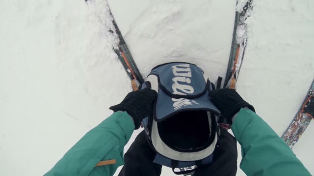 Skier Prepares To Move Down The Slope