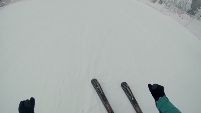 Skier Moves Down The Slope