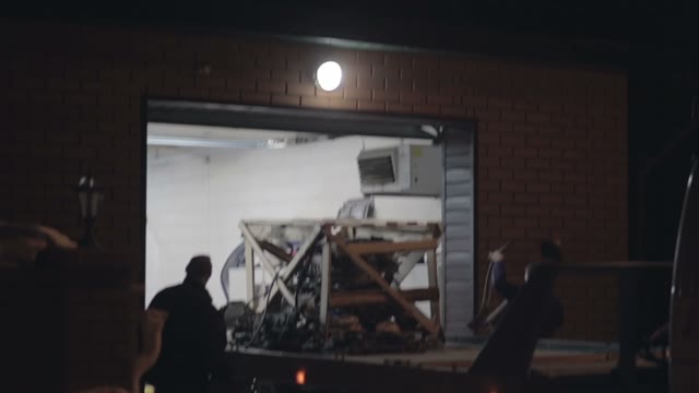 Truck Takes Away Engine Car From The Garage