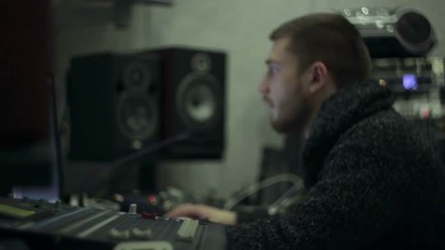 Sound Engineer At Work In The Studio