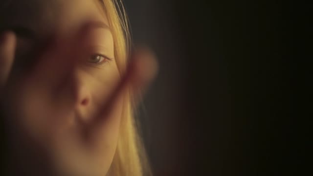 Attractive Girl Looks In The Mirror
