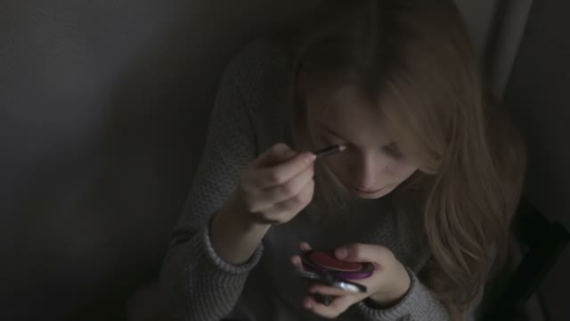 Young Girl Looks In The Mirror