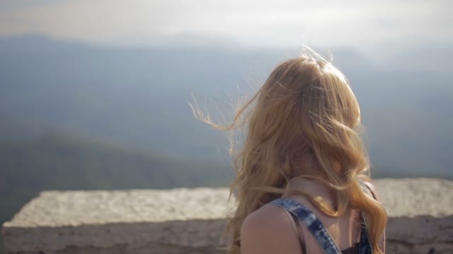 Attractive Girl Looks Into The Distance With The Great Chinese Wall