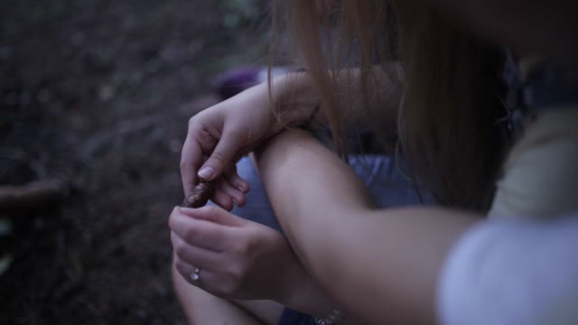 Guy Hugs The Girl In The Forest. Close-up Of The Hands Of A Girl, She Is Holding