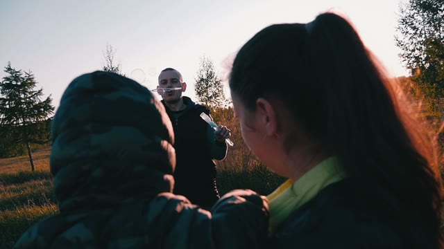 Couple Playing With Soap Bubbles