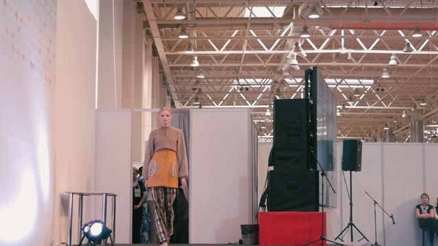 Fashion Show. Female Models In Dresses Go On The Catwalk