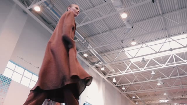Fashion Show. Female Models In Dresses Go On The Catwalk