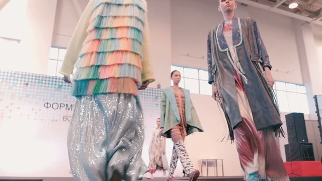 Fashion Show. Female Models In Dresses Go On The Catwalk