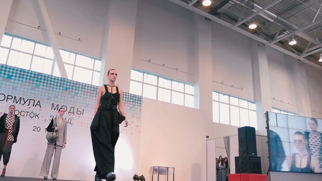 Fashion Show. Female Models In Dresses Go On The Catwalk