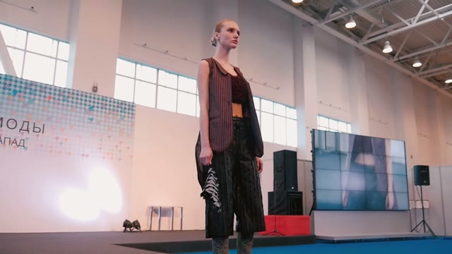 Fashion Show. Female Models In Dresses Go On The Catwalk