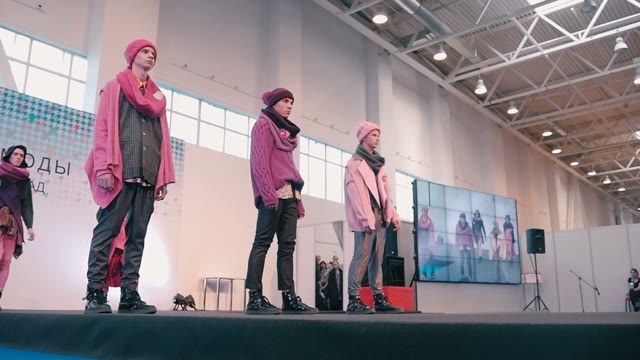 Fashion Show. Male Model In The Dresses Go On The Catwalk