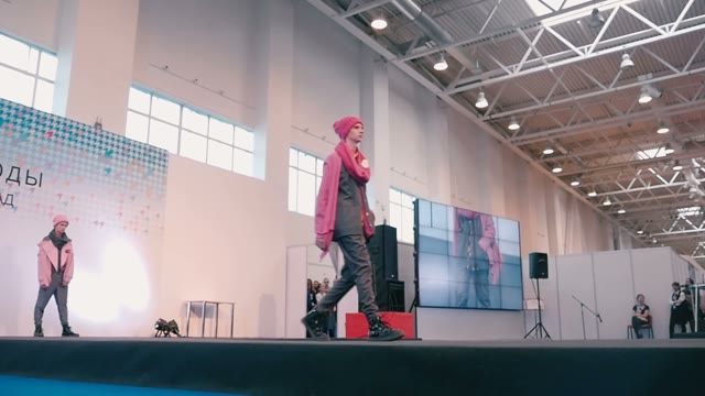 Fashion Show. Male Model In The Dresses Go On The Catwalk