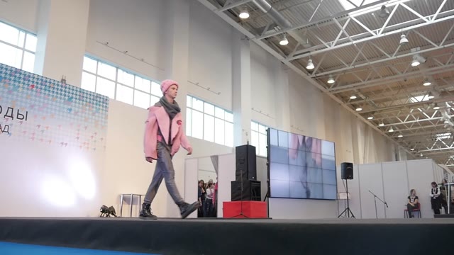 Fashion Show. Male Model In The Dresses Go On The Catwalk