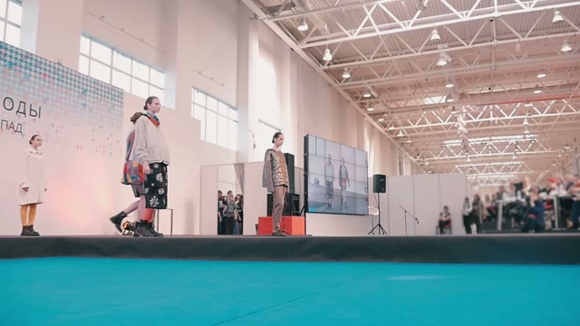 Fashion Show. Female Models In Dresses Go On The Catwalk