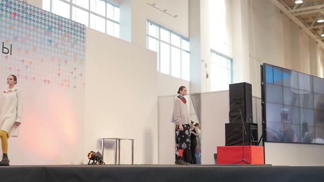 Fashion Show. Female Models In Dresses Go On The Catwalk
