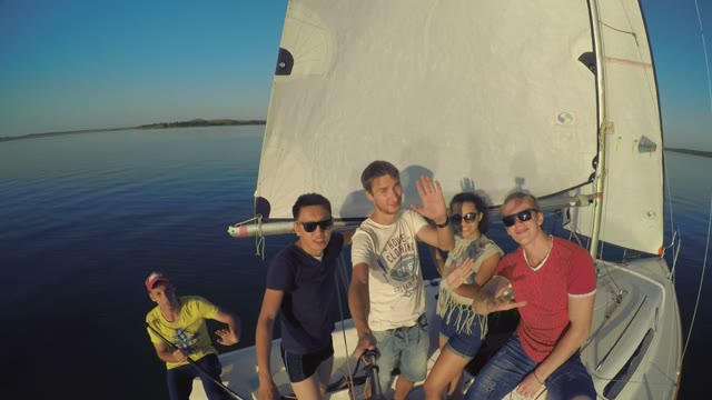Group Of Young People On A Sailing Boat