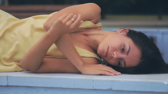 Beautiful Girl Posing In Front Of Camera And Stretches