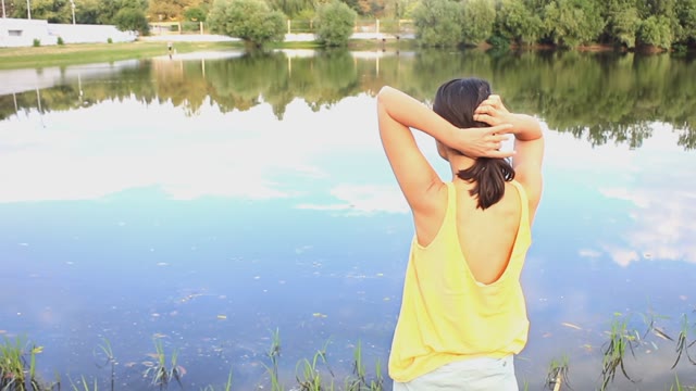 Beautiful Young Woman Dancing By The River