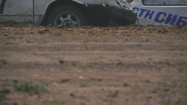 Several Rally Cars Passing On The Dusty Road