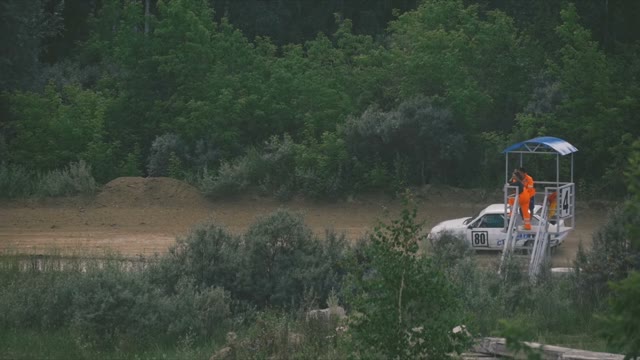 Two Rally Cars Passing Through The Road