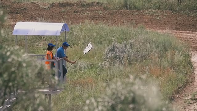The Referee Waves A Flag At The Finish Of The Rally