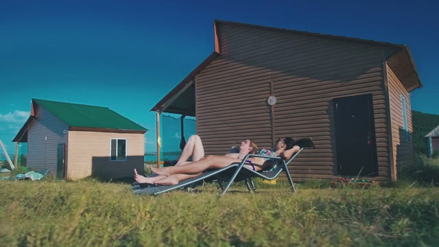 In Love Couple Tans In The Backyard Of His House