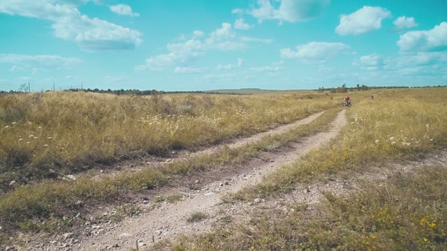 A Young Man Riding A Quad Bike On A Field