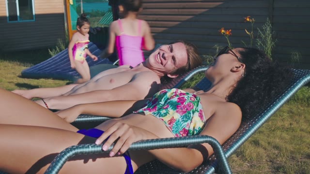 In Love Couple Tans In The Backyard Of His House