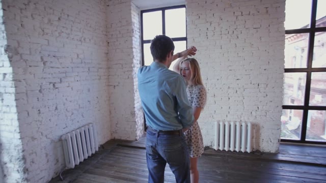 Young Couple In Love Is Learning To Dance In The Studio