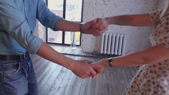 Young Couple In Love Is Learning The Dance Studio