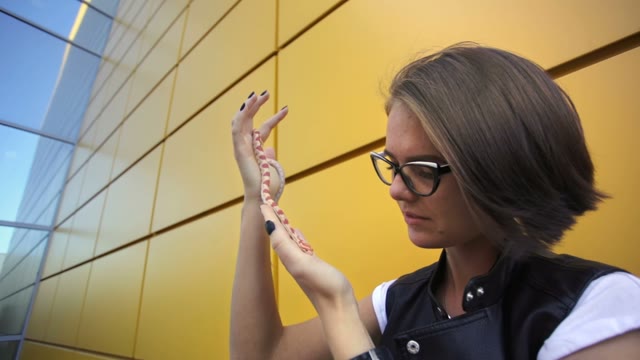 Fascinating Young Girl Posing With A Snake On The Street