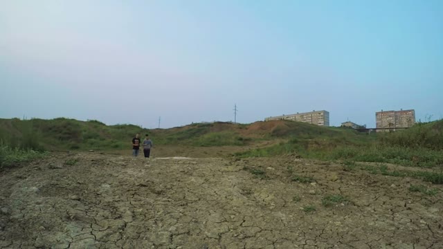 Radio-controlled Car Jumps From Hill And Fly Near The Camera