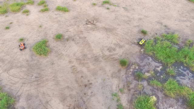 Two Cars On The Radio Control Rides On The Field