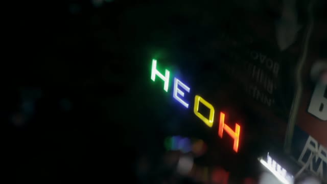 Neon Sign In The Reflection In A Puddle
