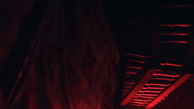 Blinking Red Light In The Darkness In Urban Slums