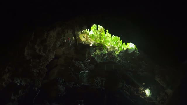 The Camera Shoots Down Into A Deep Cave