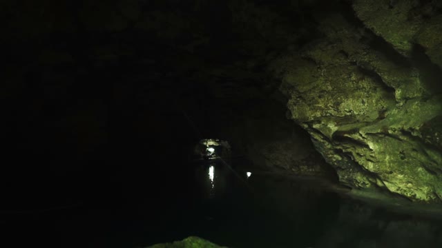 Inside The Dark And Deep Cave Lit Lantern