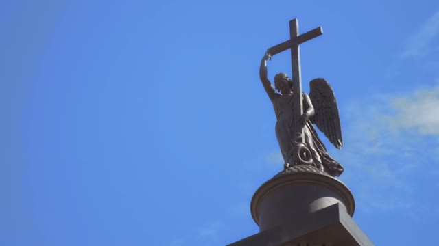 Sculpture In The Form Of A Girl With Cross