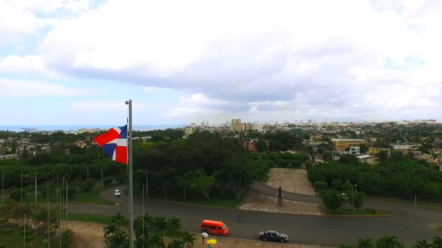 The Camera Flies Past A Waving Flag Of The Dominican Republic