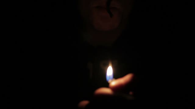 Man In The Dark Cigarette Ignites