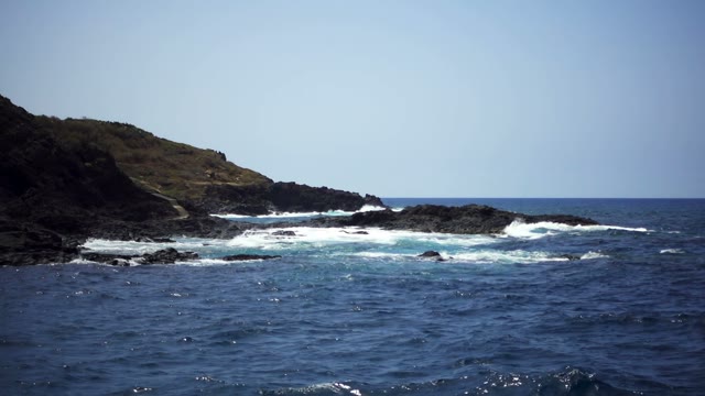 Waves Beating Against The Rocks