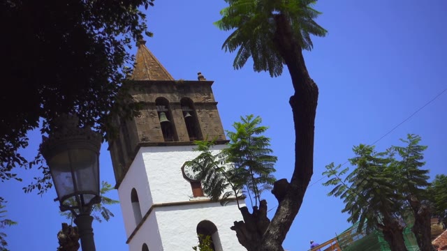 A Small Bell Tower On Sky Background
