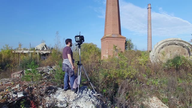 Man Standing With Film-making Equipment