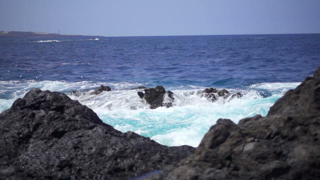 Sea Waves Beating Against The Stone Beach