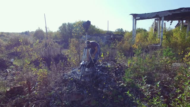 Man Standing With Film-making Equipment