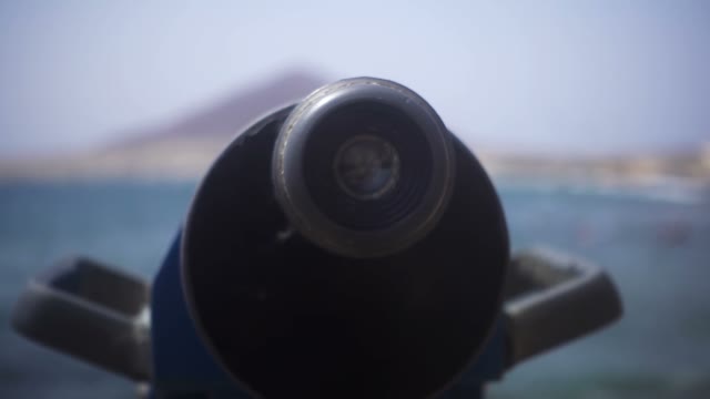 The Camera Zooms In Binoculars