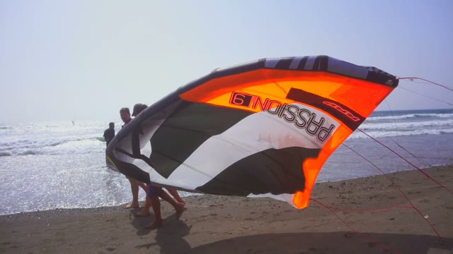 Kite Surfers Are On The Seashore