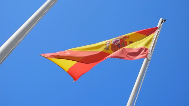 Spanish Flag Flying On A Flagpole