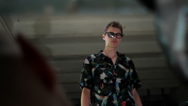 Man In Glasses Speaks With A Man Close-up